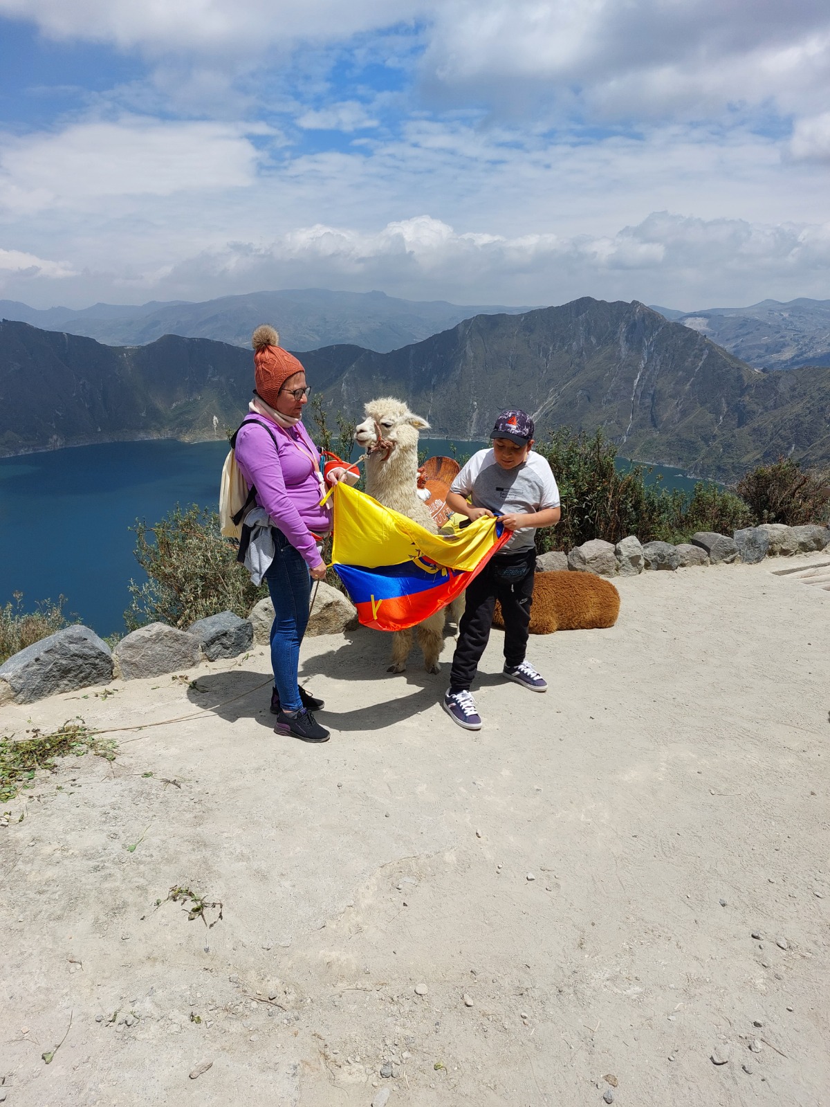 Andean lagoon viewpoint with travelers